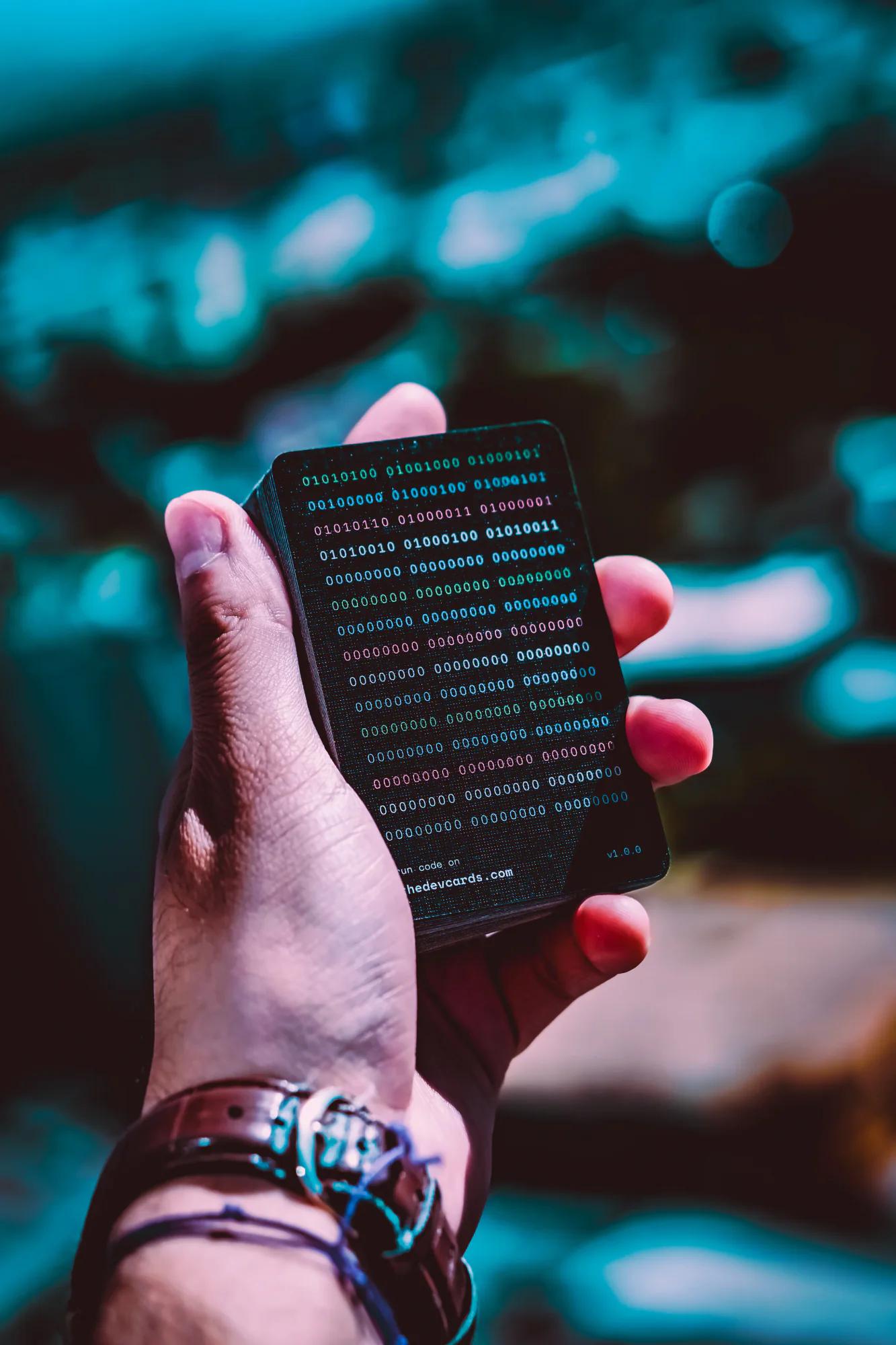 A developer holding a personalised TheDevCards deck